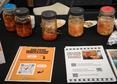 Community educator Jerald Harris displayed a few jars of fresh kimchi and sauerkraut for people to try, along with printed guides on how to ferment kimchi.  Credit: Grace Xue