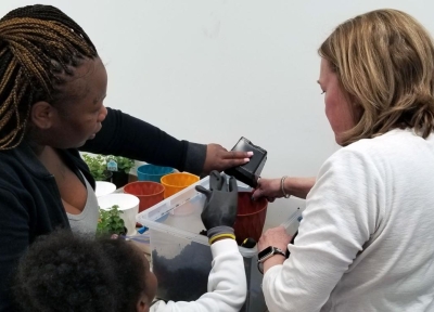 At the “Spring Fling” Meet and Greet at Hillside Manor, participants learned about repotting plants and caring for herbs. Each participant repotted an herb plant into a larger container to take home.  Credit: Marcia McIntyre