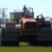 Man driving a tractor in the field.  Photo: KEZI