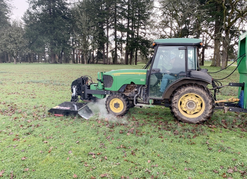 An electric weed control unit, attachedt to a tractor, in use during the first practice phase of research